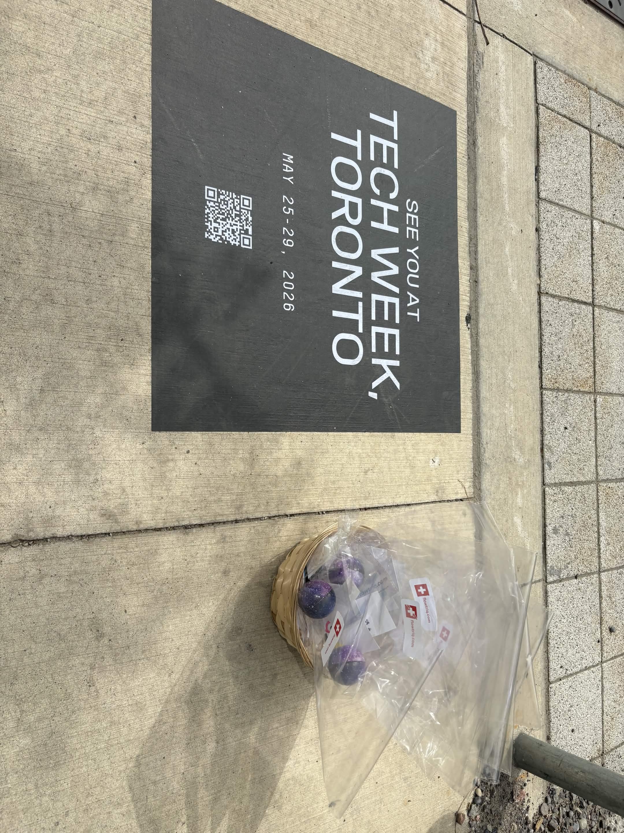 Flowtriq Server First-Aid Kits next to the Toronto Tech Week sign